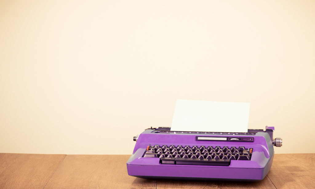 Purple typewriter for content writing services